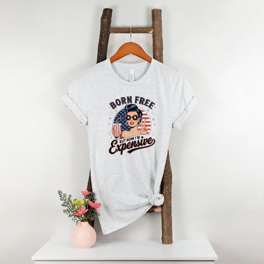 Born Free but Now I'm Expensive T-Shirt Hanging up in Ash