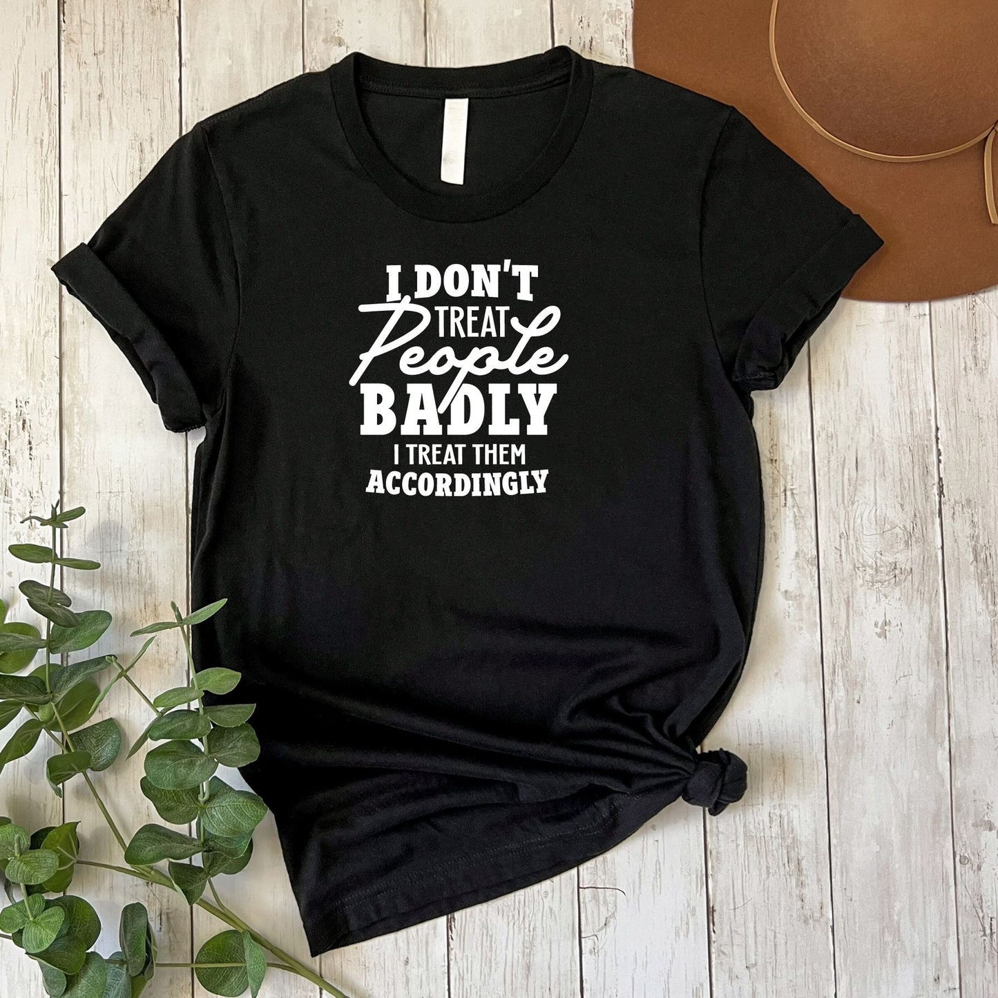 I Don't Treat People Badly T-Shirt Flat Lay in Black 