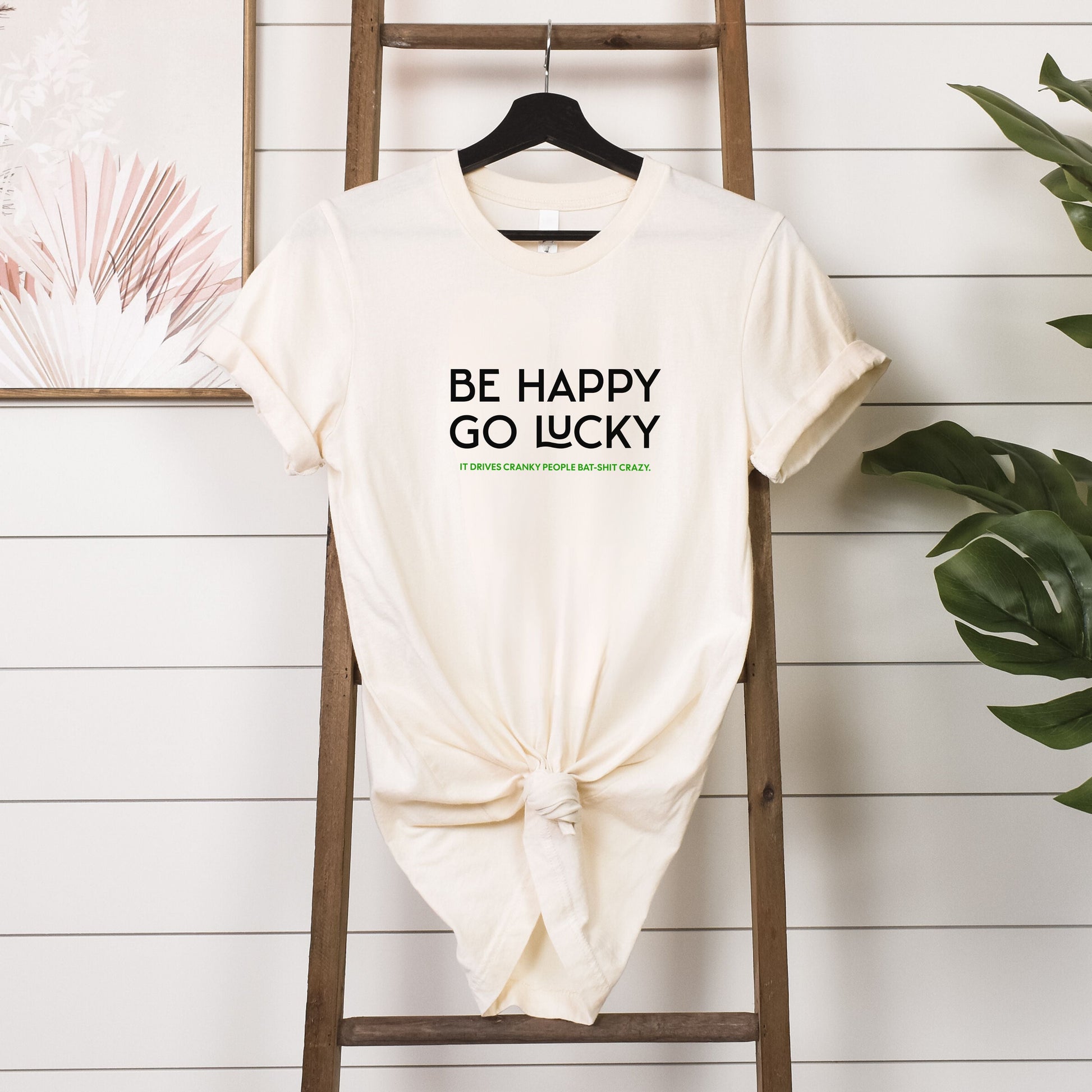 T-shirt - Be happy go lucky - hanging in natural 